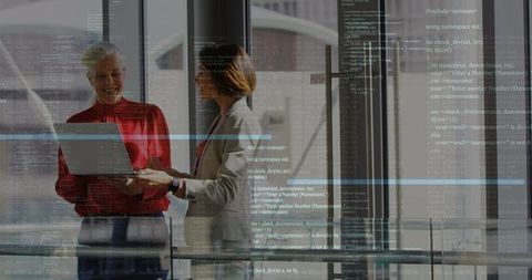 Diverse Business Professionals Engaging with Digital Data Overlay