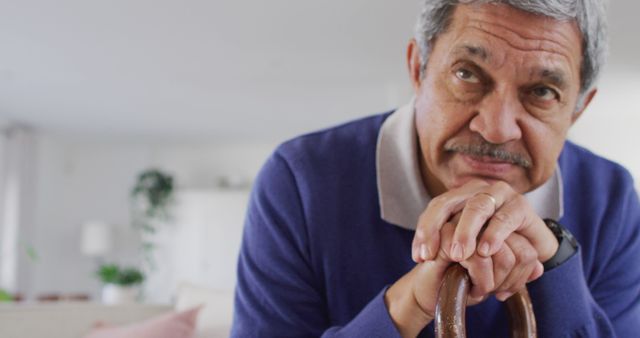 Elderly Man with Walking Cane Looking Thoughtful at Home - Download Free Stock Images Pikwizard.com