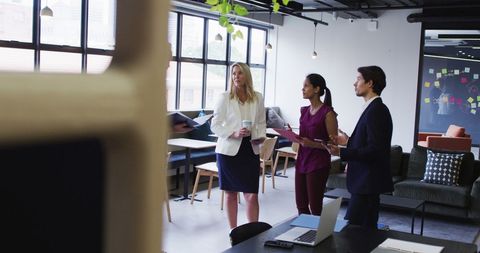 Business Team Collaborating in Modern Office with Face Masks