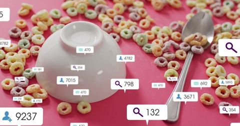 Flipped bowl with multicolored cereal and digital icons