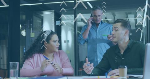 Team Analyzing Data Trends in Modern Office Setting