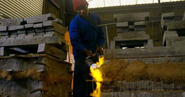 Industrial Worker Using Blow Torch in Factory Setting - Download Free Stock Images Pikwizard.com