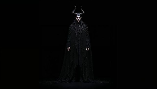 Mystical gothic performer in dramatic horned costume