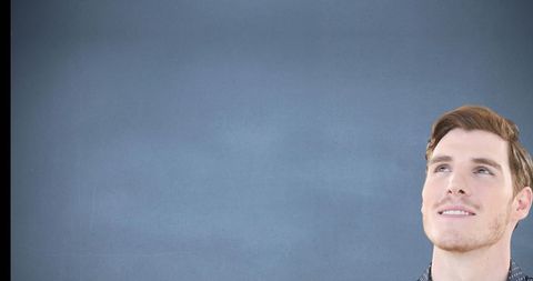 Man Looking Up against Blue Background, Imagining Ideas - Download Free Stock Images Pikwizard.com