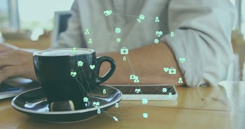 Typing remote worker at cafe with digital health network overlay and coffee cup focus