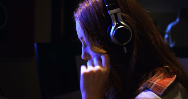 Young Woman Wearing Headphones in Recording Studio with Low Light - Download Free Stock Images Pikwizard.com