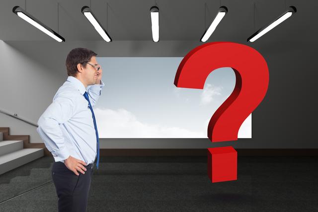 Digital composite of Digital composite image of businessman looking at red question mark