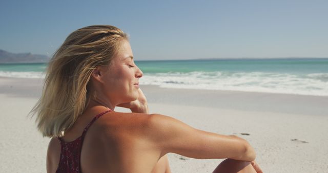 Woman Relaxing on Sunny Beach Enjoying Sea Breeze - Download Free Stock Images Pikwizard.com