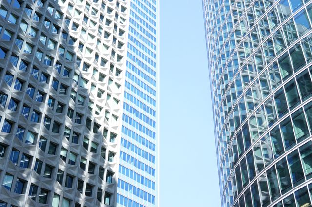 Modern Skyscrapers with Reflective Glass Facades in Sunlight - Download Free Stock Photos Pikwizard.com