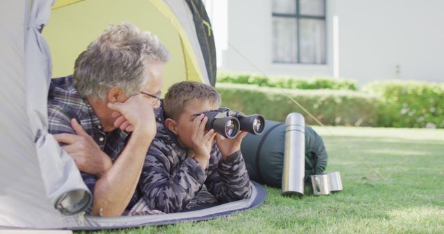 Grandfather and Grandson Having Camping Fun in Tent with Binoculars - Download Free Stock Images Pikwizard.com