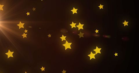 Golden Stars Sparkling Against Warm Brown Background - Download Free Stock Images Pikwizard.com