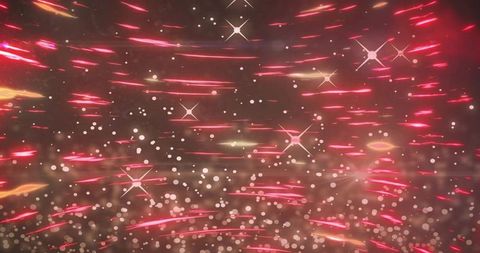 Streaming red and pink light streaks with gold bokeh motion blur background