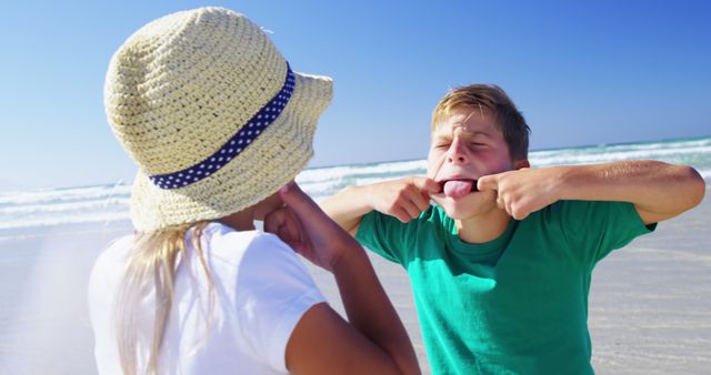 Kids Enjoying Sunny Day at Beach Making Funny Faces - Download Free Stock Images Pikwizard.com