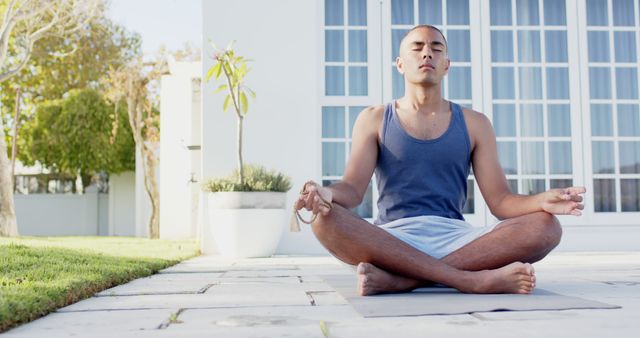 Man Meditating Outdoors in Garden on Sunny Day - Download Free Stock Images Pikwizard.com