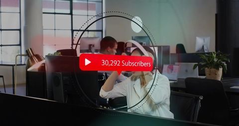 Content creator adjusting headset in modern open-plan office with subscriber overlay