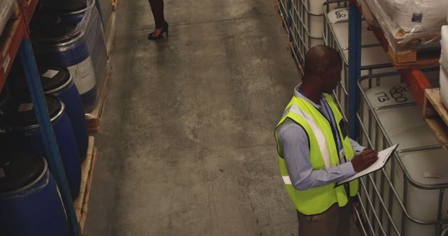 Warehouse Worker Recording Inventory in Storage Facility - Download Free Stock Images Pikwizard.com