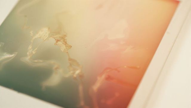 Glossy abstract art print featuring teal to peach gradient with gold foil veins on white mat