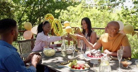Joyful African American Group Celebrating Birthday Outdoors