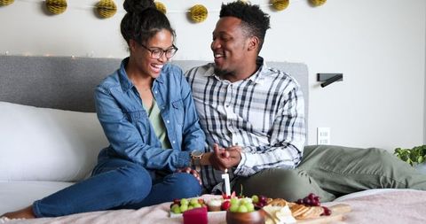 Happy Interracial Couple Celebrating Anniversary at Home