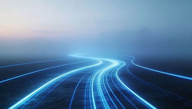 Curving neon blue light trails on dark paved road at dusk with foggy horizon