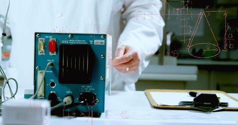 Scientists analyzing mathematical equations in modern lab setting