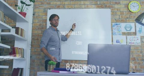 Professional presenting network diagram in modern office