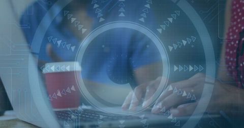 Woman Engaged in Digital Work on Laptop at Modern Office Desk