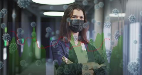 healthcare professional standing with mask in hospital corridor - Download Free Stock Images Pikwizard.com