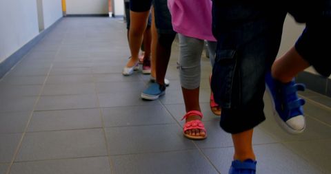 Schoolchildren Walking in Line in Corridor - Download Free Stock Images Pikwizard.com