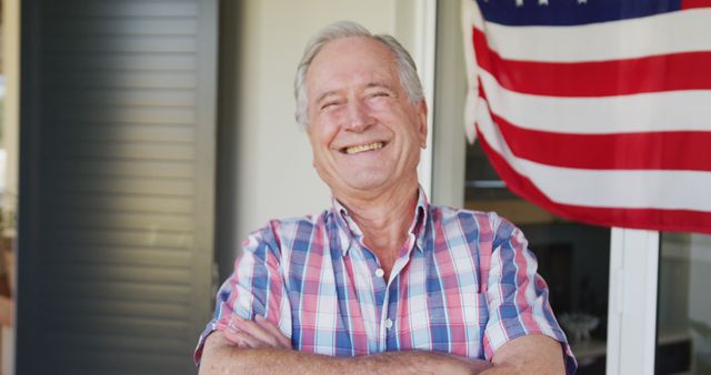 Image of happy smiling caucasian senior manoutside of house. Patriotism, armed forces and family life.