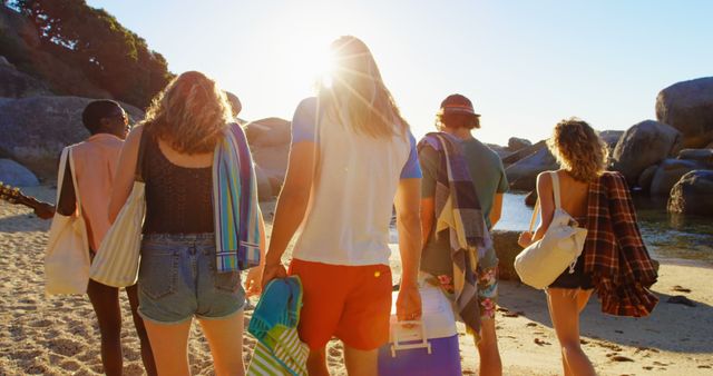 Group of Friends Walking on Beach with Sunset - Download Free Stock Images Pikwizard.com