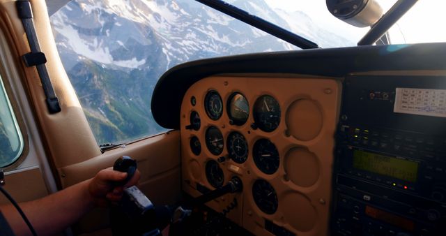 Pilot Navigating Small Aircraft Control Panel High Above Scenic Mountains - Download Free Stock Images Pikwizard.com