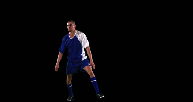 Football Player in Action on Isolated Black Background - Download Free Stock Images Pikwizard.com