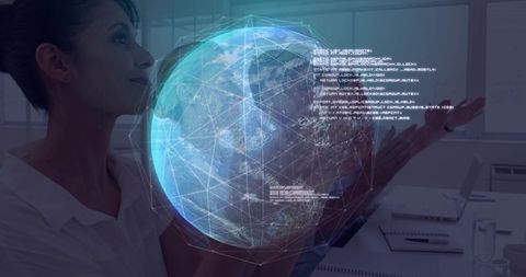 Businesswoman studying holographic earth globe above desk showing global network data