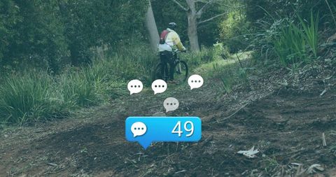 Cyclist with chat bubbles navigating forest trail