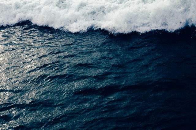 Ocean Waves Crashing Against Dark Blue Sea Surface - Download Free Stock Photos Pikwizard.com