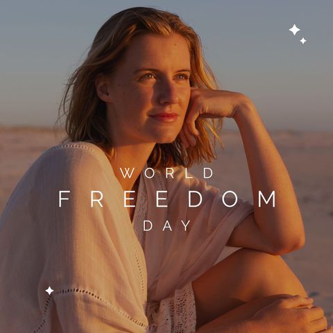 Reflective woman celebrating world freedom day at beach sunset