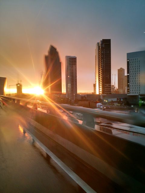 Sunset Cityscape with High-Rise Buildings and Reflections - Download Free Stock Photos Pikwizard.com