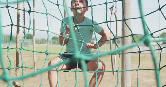 Caucasian Boy Climbing Rope Net in Outdoor Playground - Download Free Stock Images Pikwizard.com