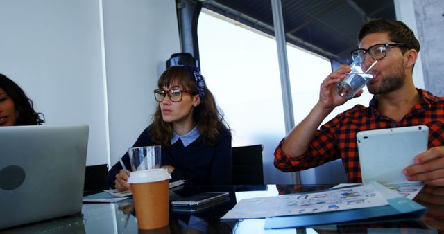 Young Professionals in Modern Office During Team Meeting - Download Free Stock Images Pikwizard.com