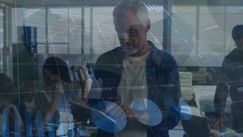 Analyzing Data Trends on Digital Tablet in Modern Office