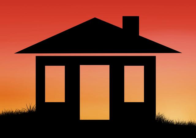 Silhouette of house on grass against orange sunset background. Ideal for real estate promotions, home decor, nature-themed designs, and peaceful evening scenes. Can be used in advertisements, brochures, websites, and social media posts to evoke a sense of tranquility and home.