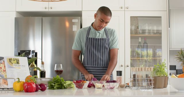 Young Man Preparing Healthy Meal in Modern Kitchen - Download Free Stock Images Pikwizard.com