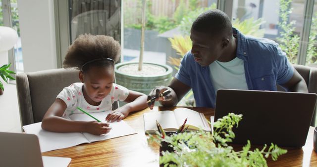 Father Helping Daughter with Homework at Dining Table in Bright Home - Download Free Stock Images Pikwizard.com