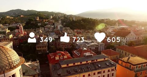 Social Media Engagement Icons with Scenic Town Background