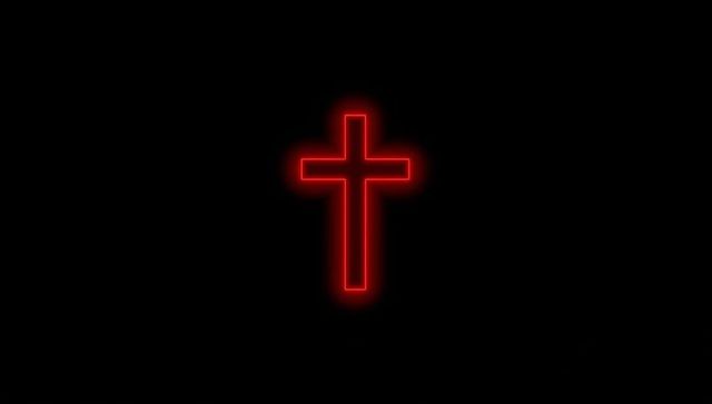 Red glowing neon cross on black background