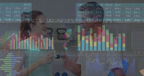 Fitness Trainer and Client Analyzing Health Data in Gym
