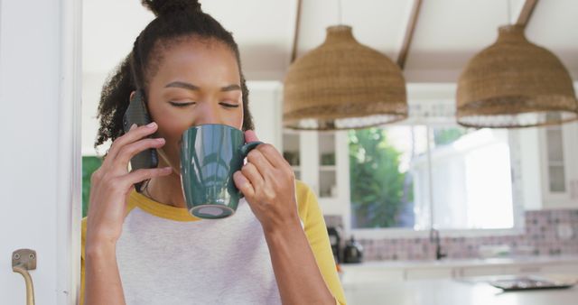 Woman Drinking Coffee During Phone Call in Modern Kitchen - Download Free Stock Images Pikwizard.com