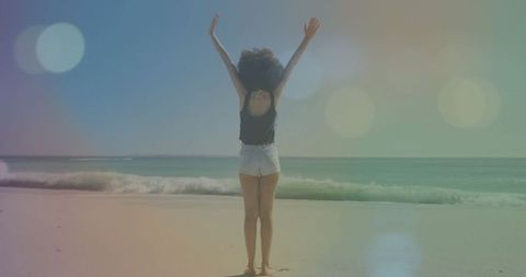 Woman Embracing Freedom by the Ocean