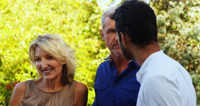 Diverse Group of Adults Engaging in Outdoor Conversation - Download Free Stock Images Pikwizard.com